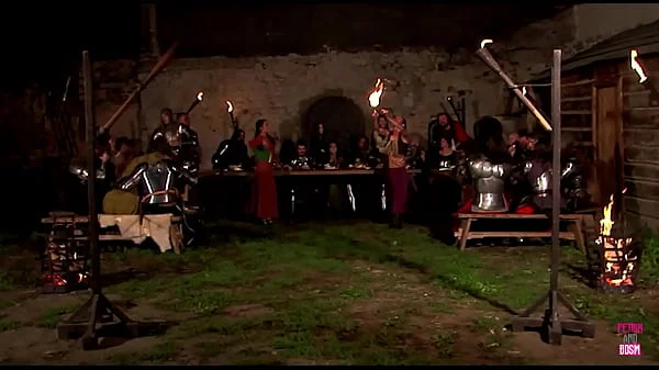 A medieval group sex party happens outside of the castle under the night sky